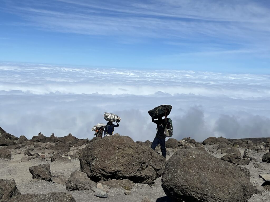 porters carrying bags at Kilimanjaro